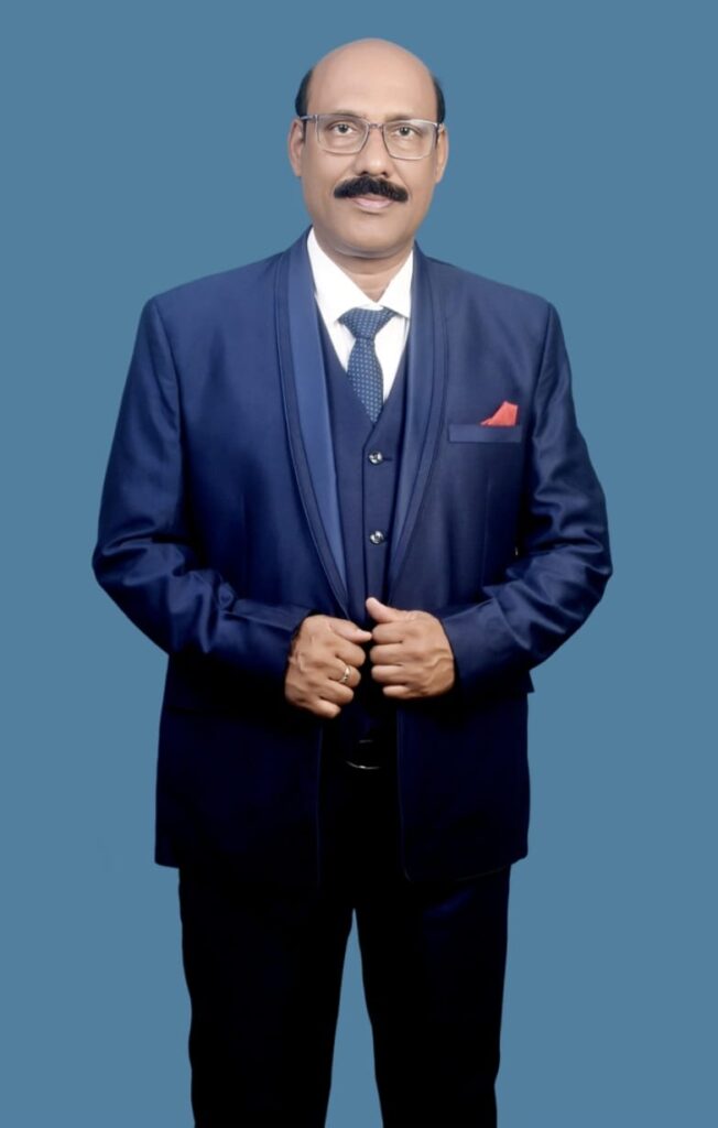 Man in formal suit against blue background.